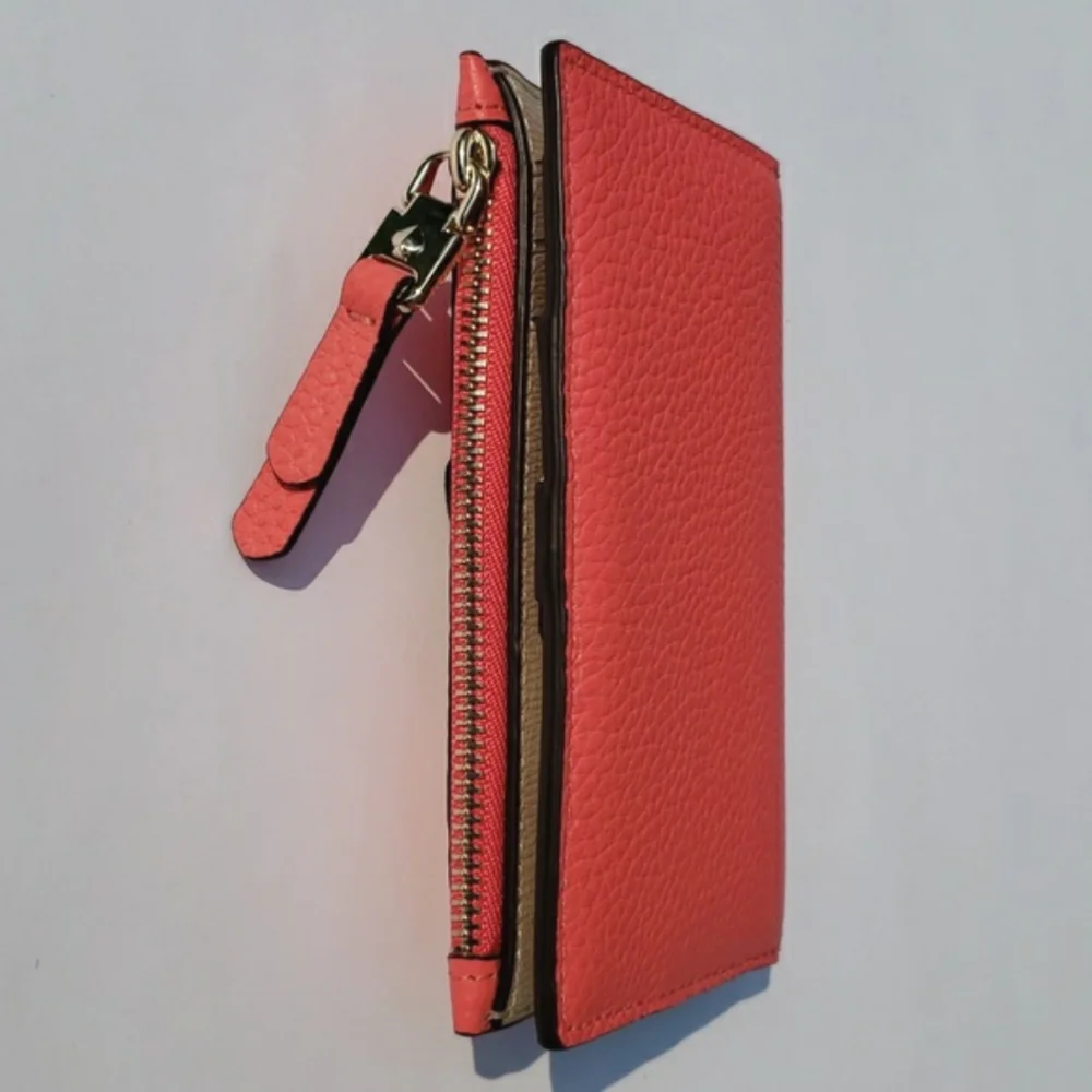 Kate Spade Leather Roulette Small Slim Bifold Wallet. Color: Peachmelba.